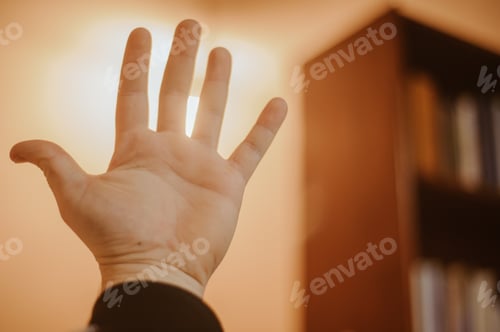 Preview: Hand reaching for light - hope concept