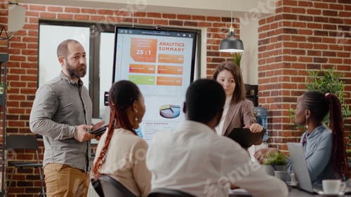 Preview: Colleagues clapping hands and celebrating successful presentation