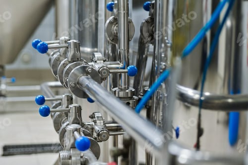Preview: Metal pipes with levers on machinery