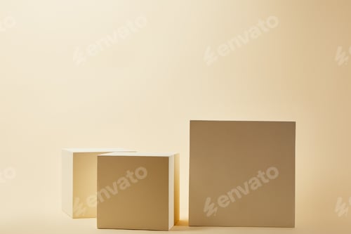 Preview: still life of cubes in various sizes on beige surface
