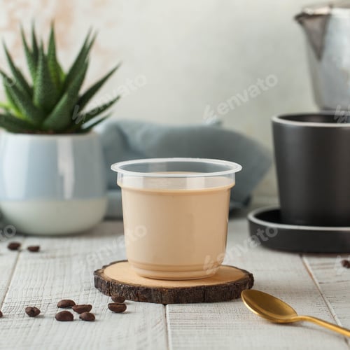 Preview: cappuccino-flavored panna cotta served in a plastic cup, perfect for a refined dessert experience.