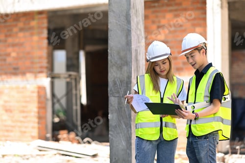 Preview: Civil engineers in safety helmet are meeting at construction site.