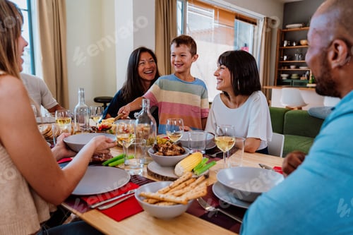 Preview: Family and friends reunion at home. Friends and family enjoying a pasta salad dinner party