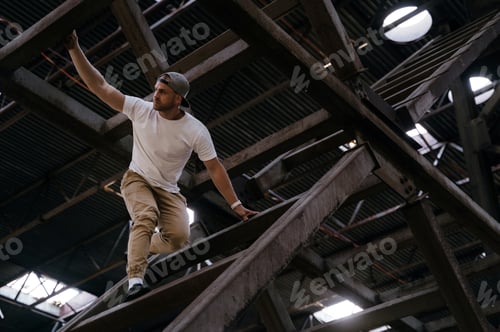 Preview: Young sportsman doing parkour in the city
