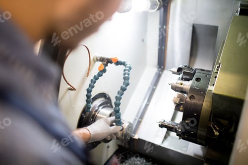 Preview: Man working on lathe machine