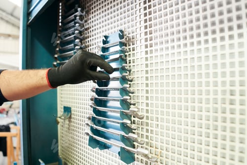 Preview: Mechanic getting wrenches from metal toolbox, close-up.