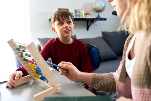 Preview: Boy is curious while homeschooling mom teaches using the abacus