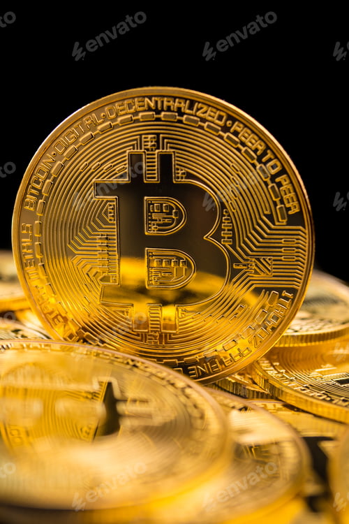 Preview: Golden coins with bitcoin symbol on a black background.