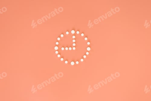 Preview: Pills in clock shape, flat lay, concept of taking pills, treatment.