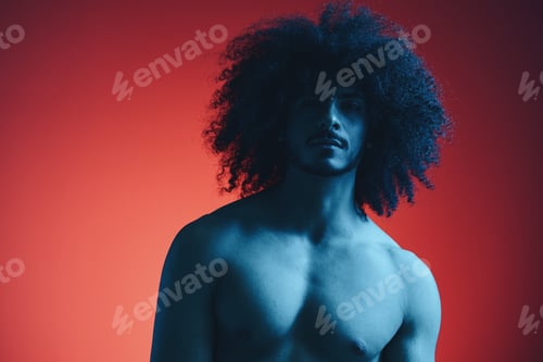Preview: Portrait of fashion man with curly hair on red background with stylish glasses, multinational