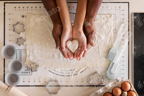 Preview: Above Shot Of Black Father And Daughter Holding Heart Made Of Dough