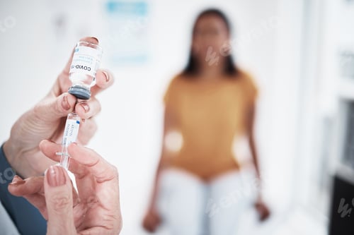 Preview: The time to take action is now. Shot of a doctor giving a patient an injection at a clinic.