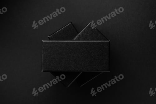Black rectangular boxes on a black background. Place for text.