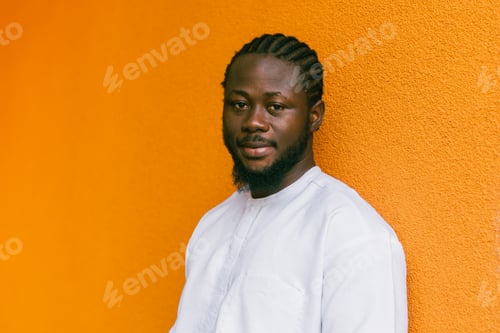 Preview: Close up portrait of a african american man smiling wearing ethnic dashiki clothes outdoor in summer