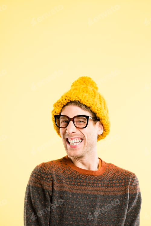 Preview: Shot of a handsome young man standing alone in the studio and laughing