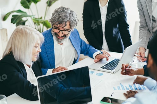 Preview: Multiracial business people working inside bank office - Focus on senior man face