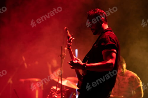 Preview: Rock and roll group performing live.