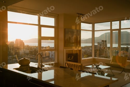 Preview: Sunset through windows of open plan apartment.