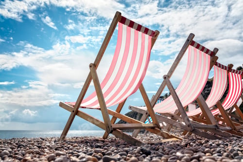 Preview: Deck chairs on the beach at the seaside summer vacation