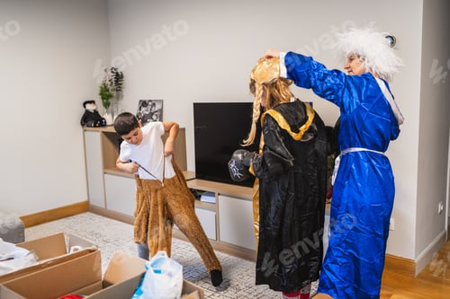 Preview: Family dressing up with carnival costumes at home