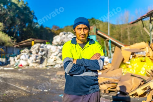 Preview: Portrait of a latin worker outdoors a recycling plant