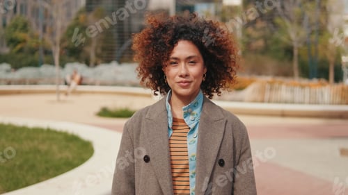 Preview: Stylish Woman Outdoors in City Park