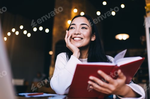 Preview: Sincerely woman holding best seller and smiling