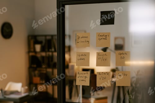 Preview: Glass Wall Displaying Business to Do List with Sticky Notes in Modern Office