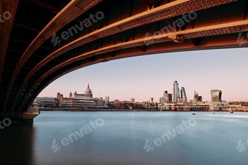 Preview: Urban skyline of London. Thames river against St. Paul's Cathedral and skyscrapes at sunset.