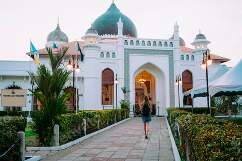 Preview: Woman on walkway near Asian church