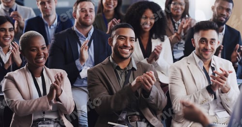 Preview: Shot of a group of businesspeople clapping during a conference in an office