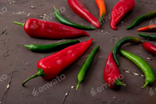Preview: close-up view of whole peppers on maroon background