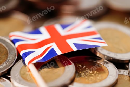 Preview: United Kingdom Flag on coins background : Business and finance concept.