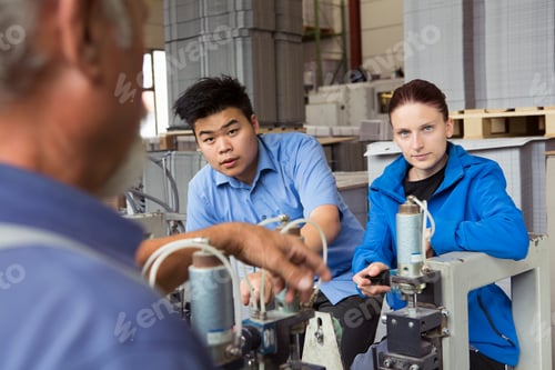 Preview: Factory workers working machinery