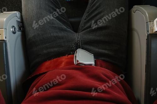 Preview: man wearing a safety Seat belt on the plane