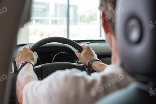 Preview: Man driving a car