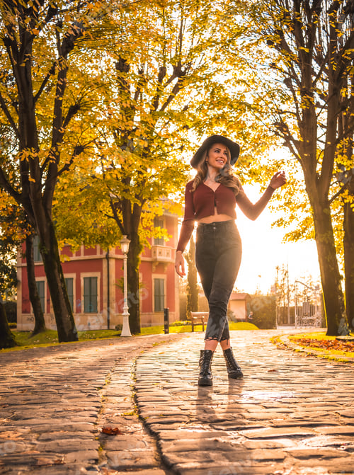 Preview: caucasian girl with hat in a forest walking in autumn