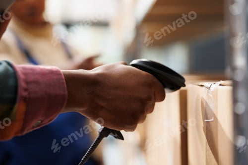Preview: African american storehouse employee arm using barcode scanner