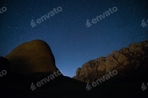 Preview: The starry sky above the mountains peaks