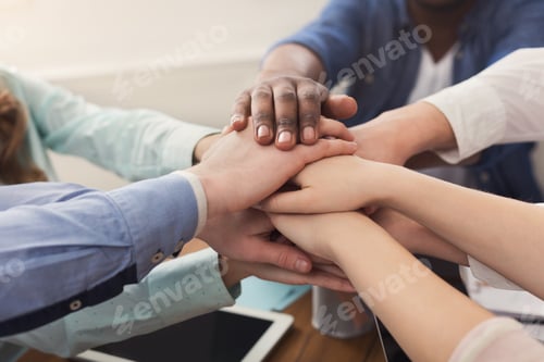 Preview: Teamwork and teambuilding, people connect hands