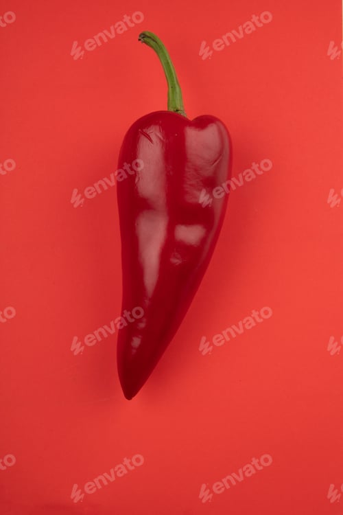 Preview: top view of fresh red chili pepper isolated on red background
