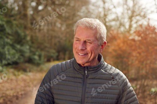 Preview: Smiling Senior Man On Walk In Autumn Countryside Exercising During Covid 19 Lockdown
