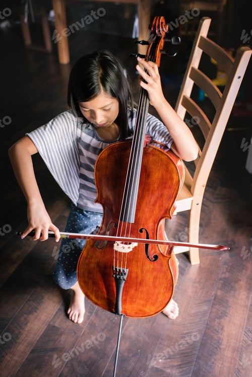 Preview: Girl practicing cello at home