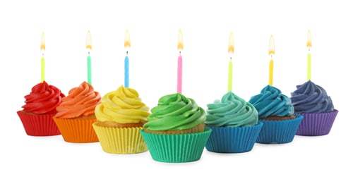 Preview: Delicious birthday cupcakes with candles isolated on white