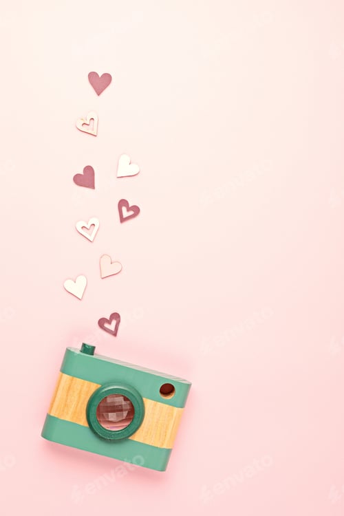 Preview: Flat lay with toy wooden camera and hearts. Social media, posts, likes, followers, online
