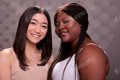 Preview: Diverse smiling cheerful beauty models looking at camera