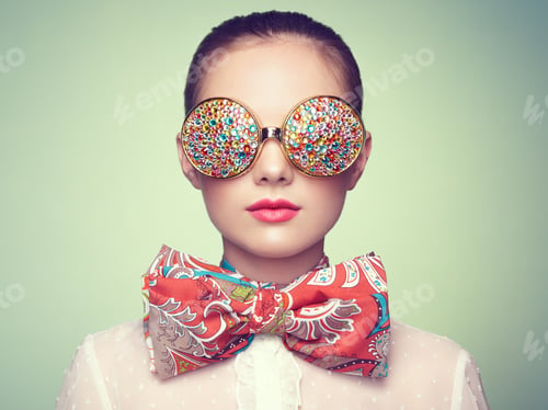 Preview: Portrait of beautiful young woman with colored glasses