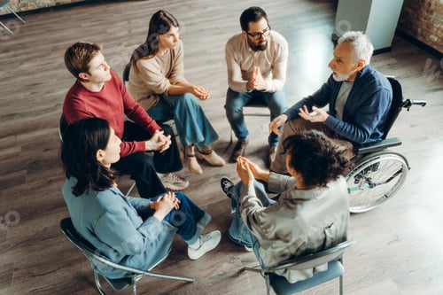 Preview: Diverse group of people participating in support group meeting