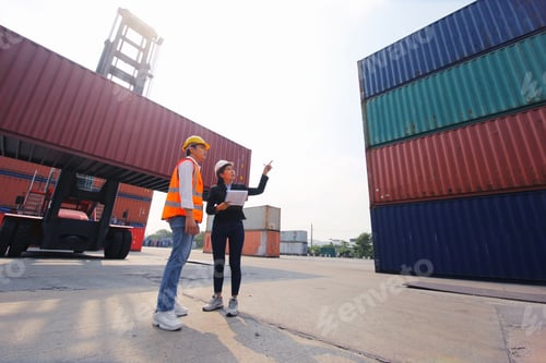 Preview: Foreman inspecting containers at import-export cargo area.