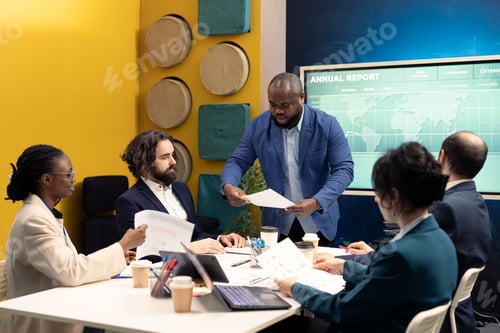 Preview: Business associates reviewing key performance indicators within the enterprise